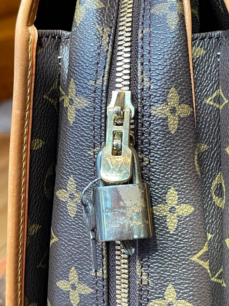 Louis Vuitton Monogram Rivoli Business Bag (peel in pocket)